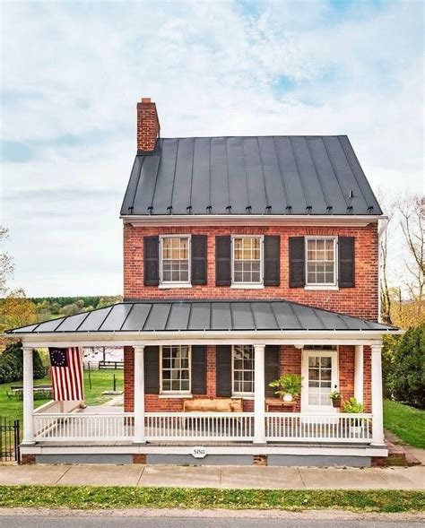 2 story farm house with metal roof|two story house with metal roof.